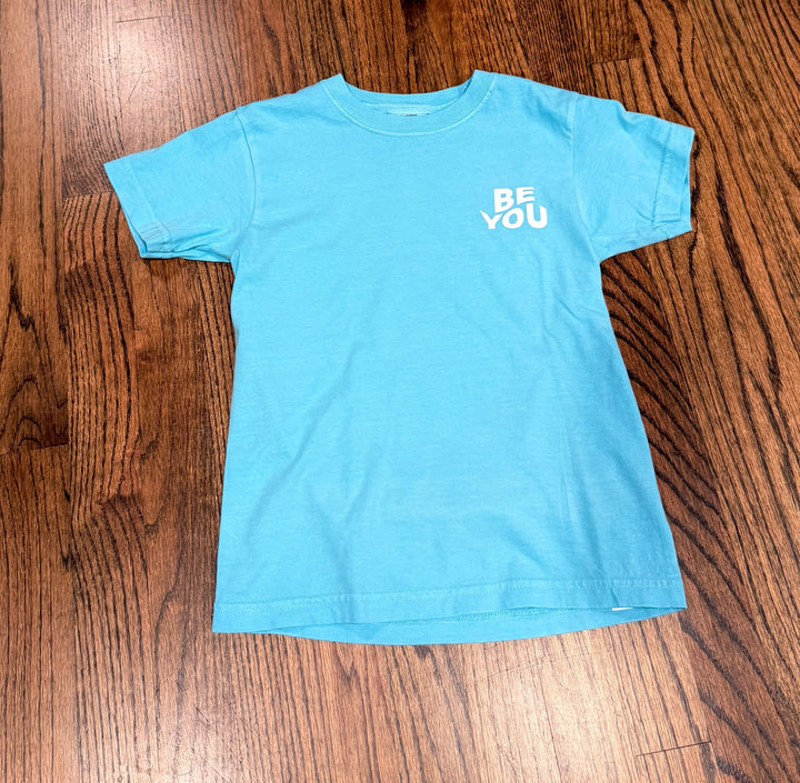 Flat lay of front of Be You Youth Tee – Kids Lagoon Blue T-Shirt