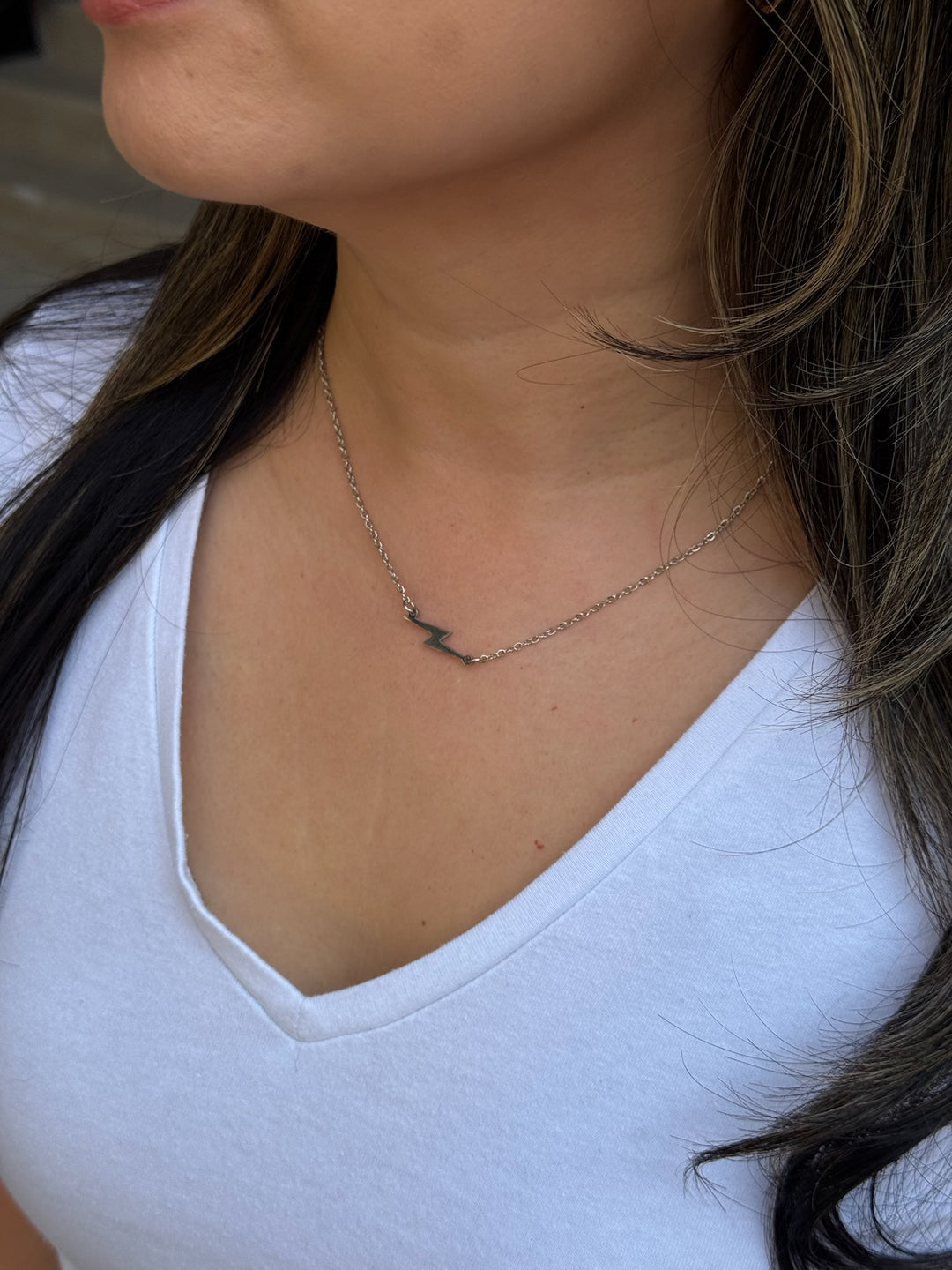 Model wearing Ladyspinedoc Lightning Bolt Necklace in Silver