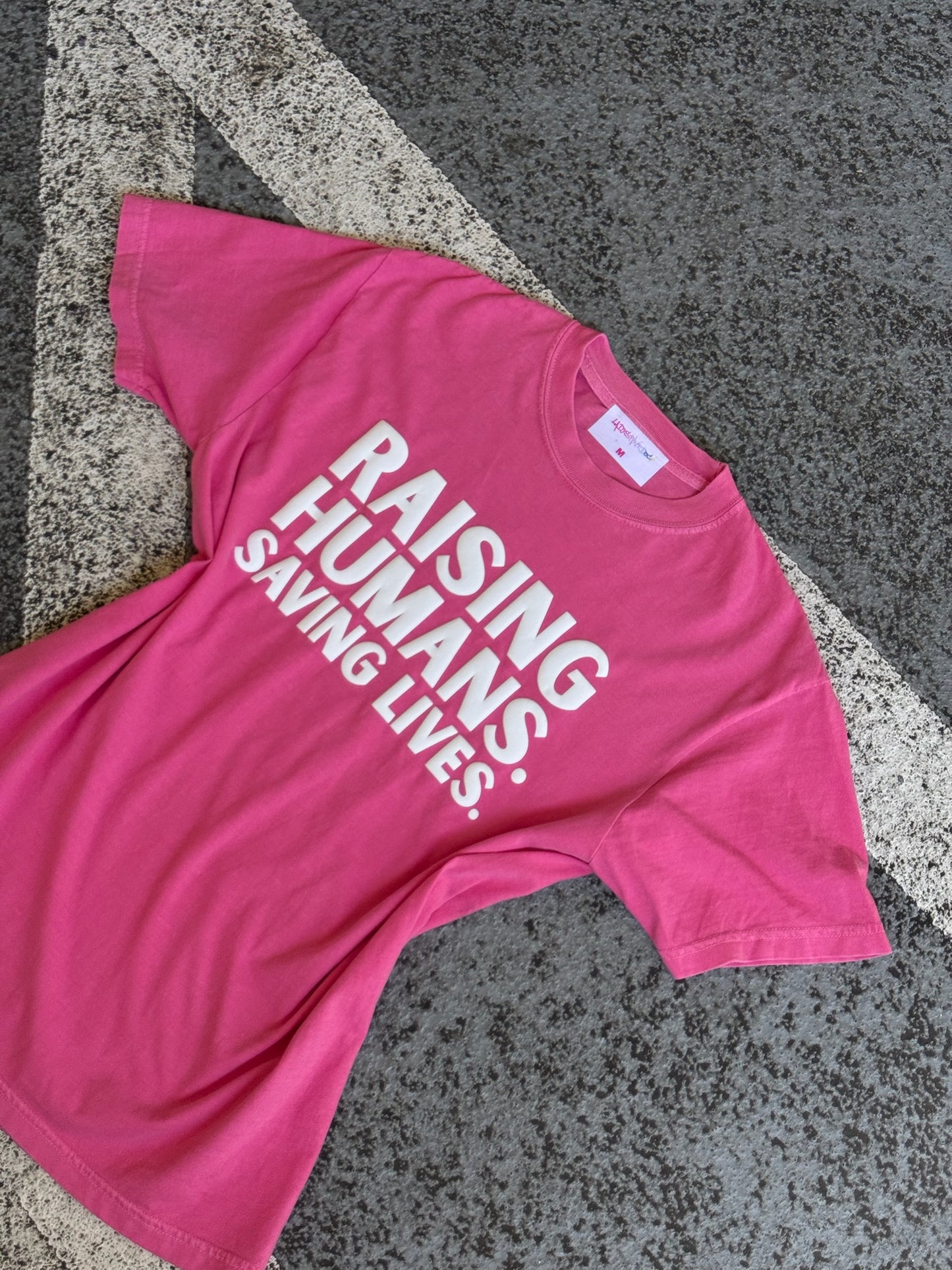 RAISING HUMANS. SAVING LIVES. Mama Tee Shirt - Pink or Blue