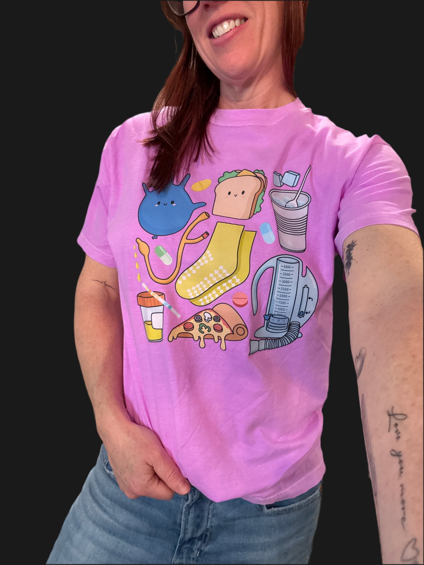 Front view of a smiling Dr. Betsy Grunch (Ladyspinedoc) wearing the Scrubhacks Collab: Nurses Week Tee Shirt - Purple Short Sleeve.