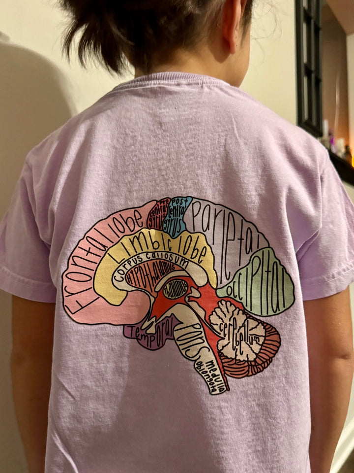Youth showing off the back of the "I Lobe You" Brain Anatomy Tee with labeled parts of the brain