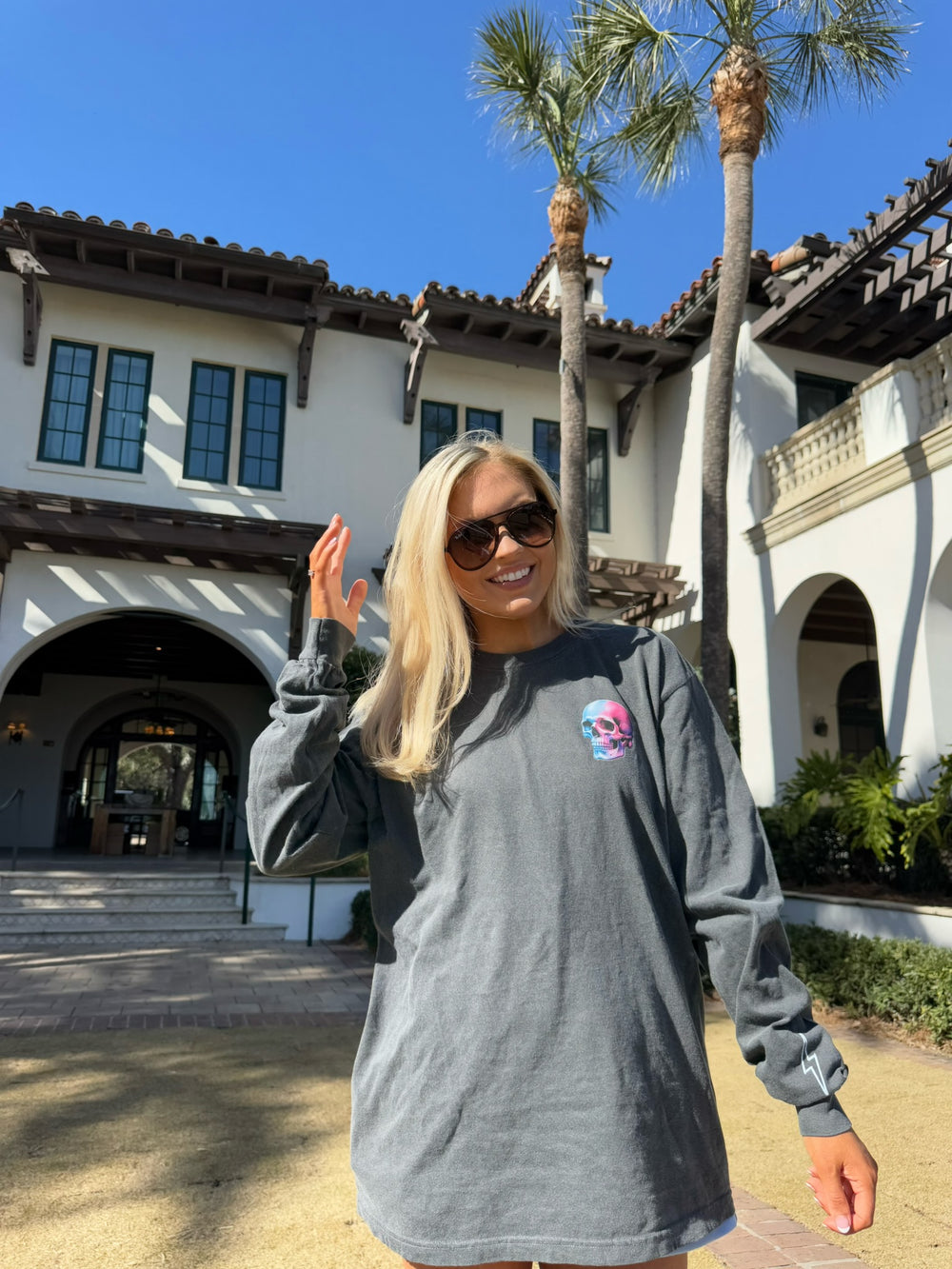 Blond model wearing Skull Powers Long Sleeve Tee Shirt - Dark Gray with Skull and Lightning Bolt Design