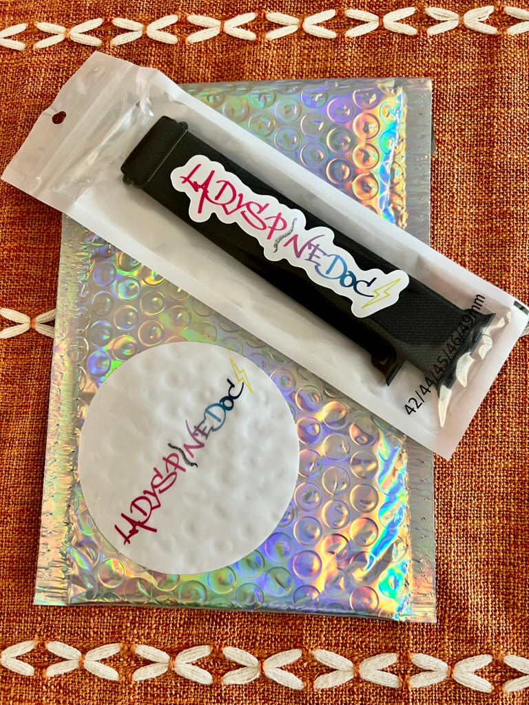 Ladyspinedoc Smartwatch Band shown in packaging on its colorful mailing envelope, both with signature Ladyspinedoc stickers.
