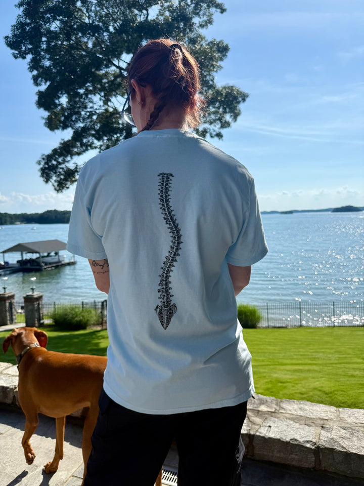 Ladyspinedoc showing the back of the Bent, Not Broken Scoliosis Awareness Tee - Blue Cotton T-Shirt