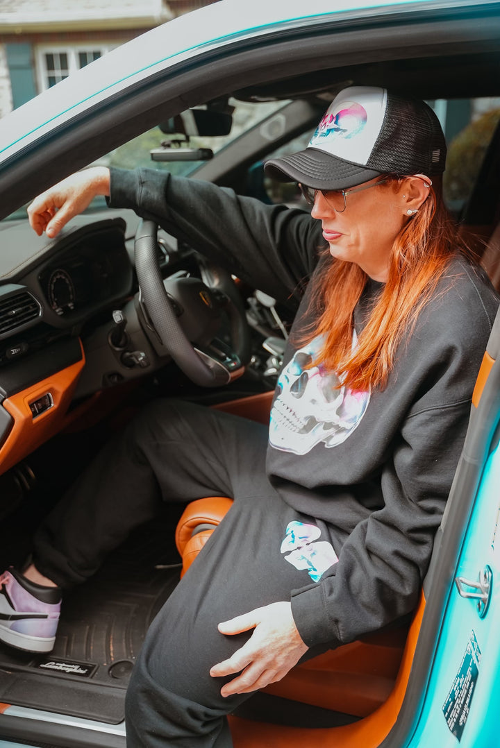 Dr. Grunch wearing the Ladyspinedoc Super Skull Crewneck Sweatshirt and sweatpants in a car.