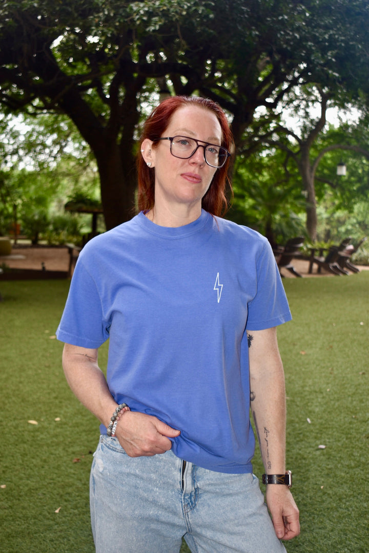Front view of Ladyspinedoc in The Incredible Tee, highlighting minimalist lightning bolt graphic on chest.