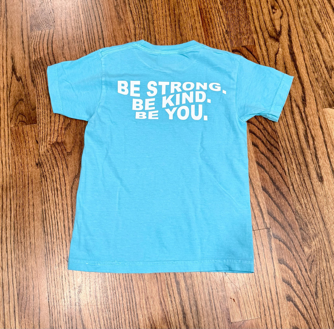 Back flat lay of Be You Youth Tee – Kids Lagoon Blue T-Shirt with Motivational “BE STRONG. BE KIND. BE YOU.” Motto displayed.