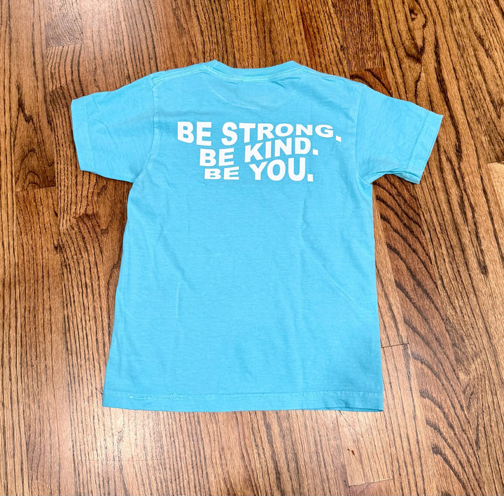 Back flat lay of Be You Youth Tee – Kids Lagoon Blue T-Shirt with Motivational “BE STRONG. BE KIND. BE YOU.” Motto displayed.