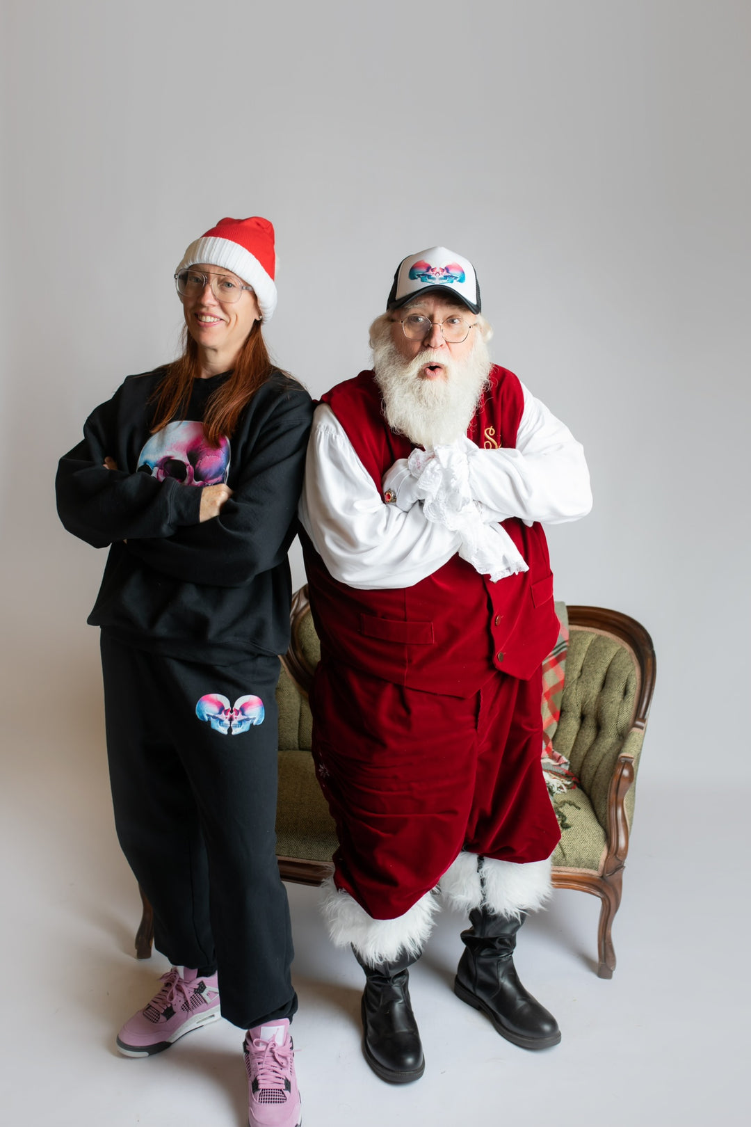 Dr. Grunch wearing the Ladyspinedoc Super Skull Crewneck Sweatshirt and Sweatpants, standing with Santa, who's wearing a Super Skull Trucker hat