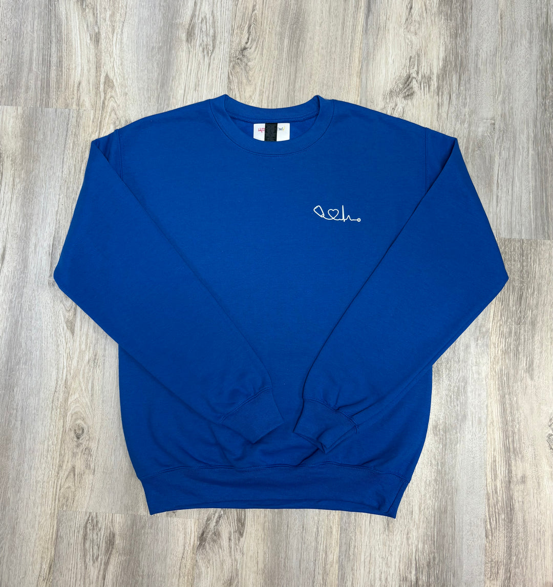 Flat lay front of Royal Blue Heart of Medicine Sweatshirt - Ladyspinedoc x Dr. Beachgem Collab