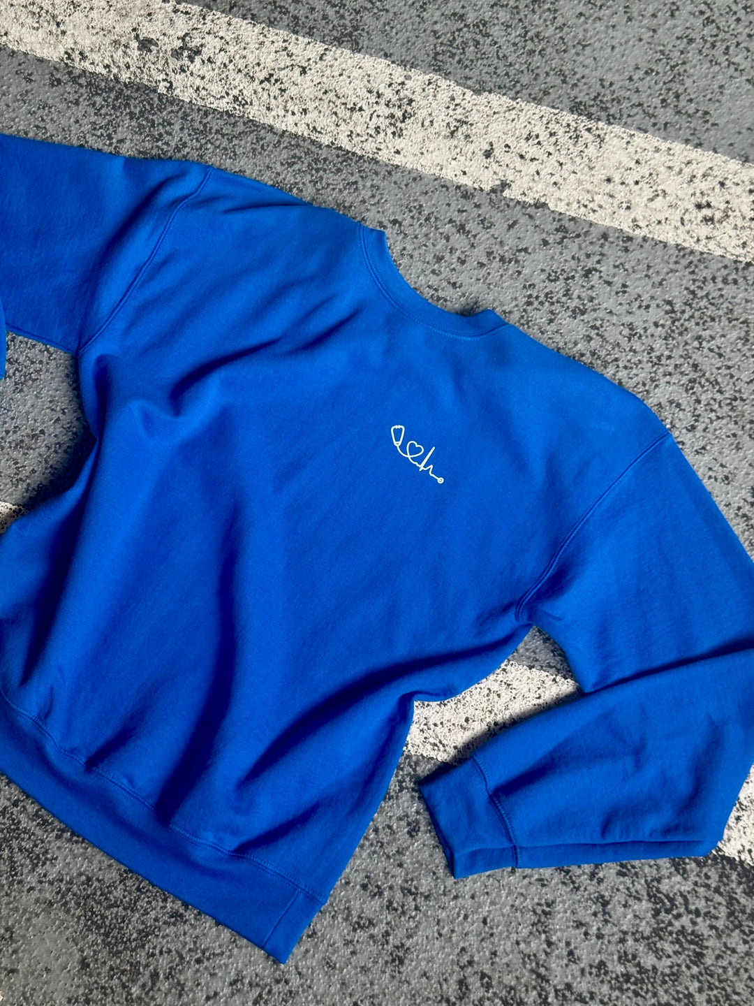 Flat lay front of Heart of Medicine Sweatshirt in Blue