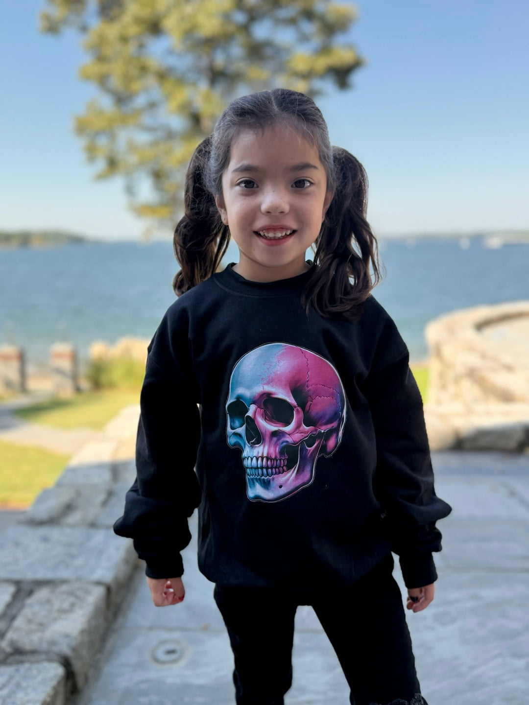 Youth wearing the Super Skull Youth Crewneck Sweatshirt – Kids Black Pullover with Skull Graphic