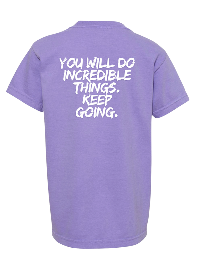 Back flat lay of the Incredible youth tee in violet with back text that says “YOU WILL DO INCREDIBLE THINGS. KEEP GOING.”