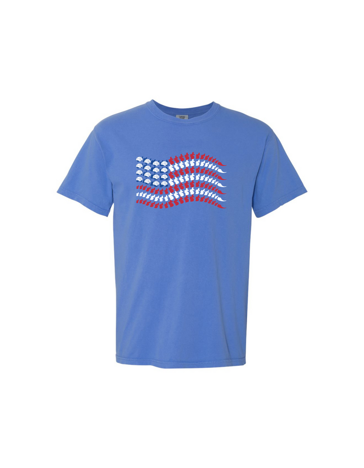 Blue t-shirt with American flag design made of brains, spines, and sacrum tailbones, laid flat on white background.