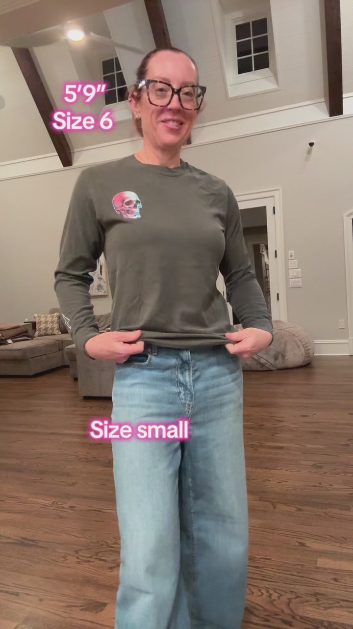 Video of Ladyspinedoc wearing Skull Powers Long Sleeve Tee Shirt - Dark Gray with Skull and Lightning Bolt Design