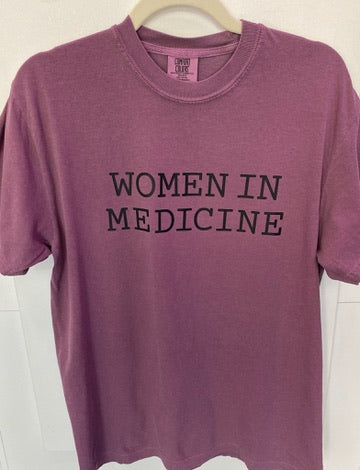 Burgundy t-shirt with 'WOMEN IN MEDICINE' text on a white background