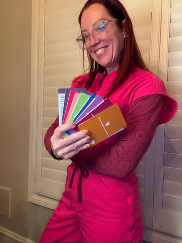 Ladyspinedoc holding neurosurgery scrub cards