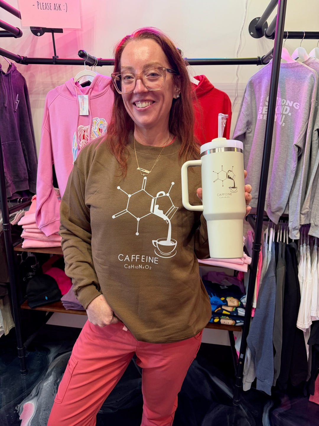Ladyspinedoc wearing Enerjava Crewneck Sweatshirt - Brown Shirt with Caffeine Molecule Design, while holding Enerjava cup