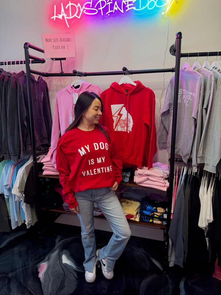 Model wearing 'My Dog Is My Valentine' Long Sleeve Red Tee Shirt in Ladyspinedoc store