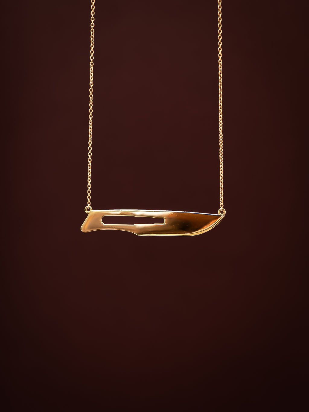 Close up of rose gold 10 Blade Scalpel Pendant Necklace