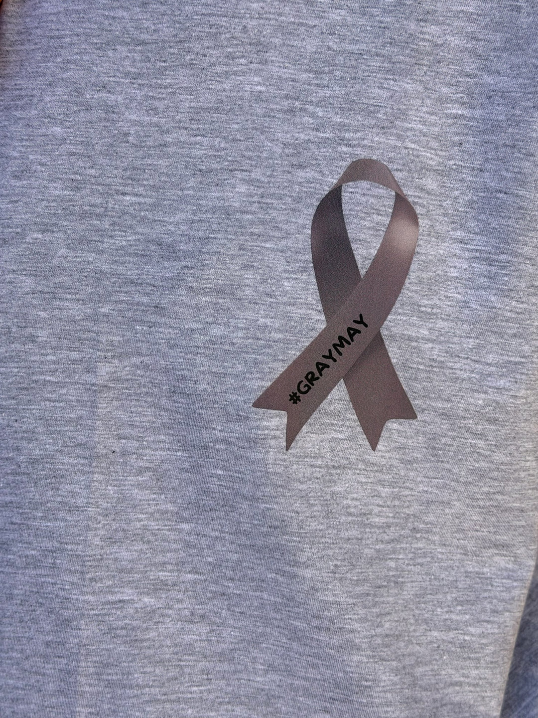 Gray ribbon with '#GRAYWAY' text on a gray background