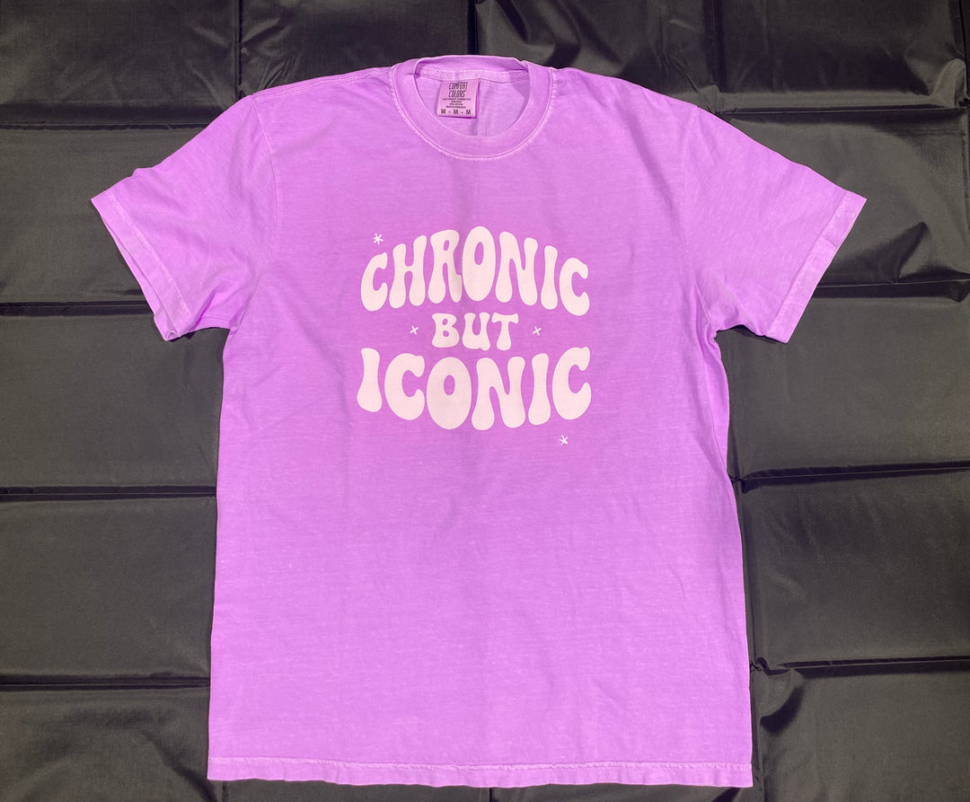 Purple t-shirt with 'Chronic But Iconic' text on a black background