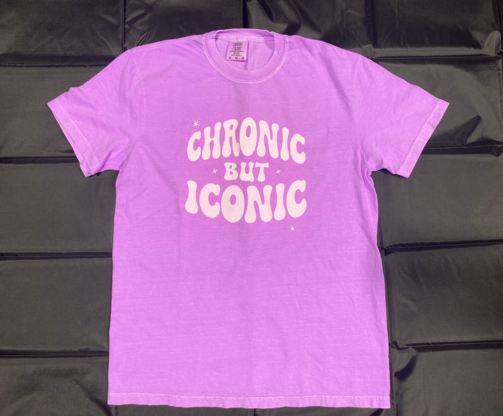 Purple t-shirt with 'Chronic But Iconic' text on a black background