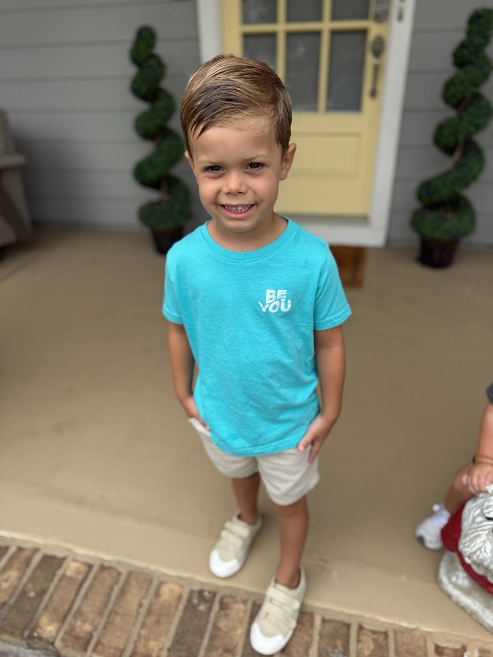 Child wearing the Be You Toddler Tee - Kids Caribbean Blue T-Shirt 