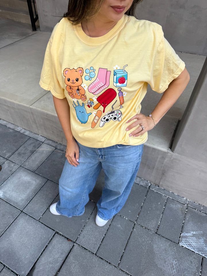 Model wearing yellow Ladyspinedoc x Scrubhacks Pediatrics Collage Tee Shirt  with jeans
