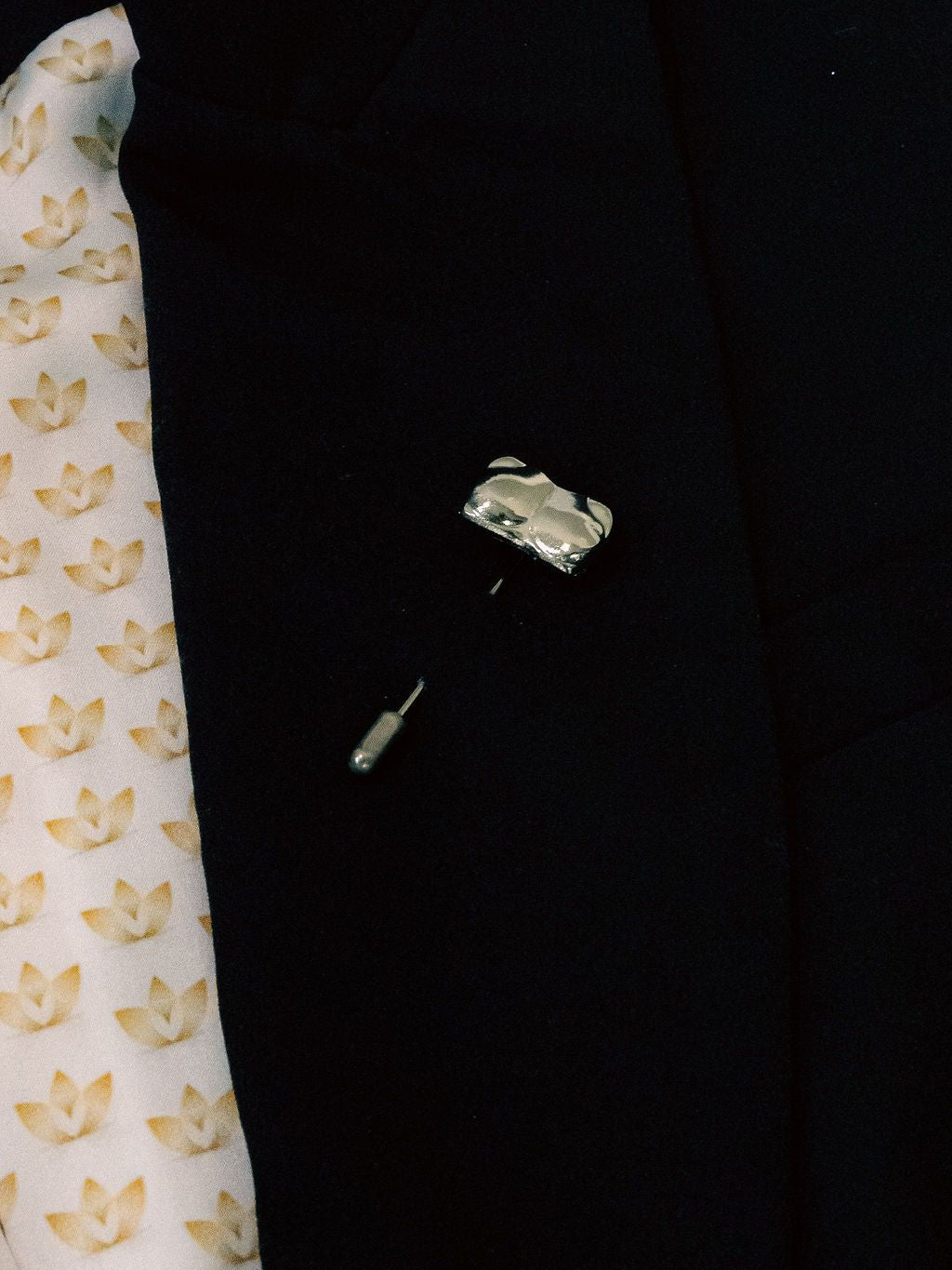 Silver Candace Bust / Breast / Bosom Stick Pin shown on a black jacket lapel