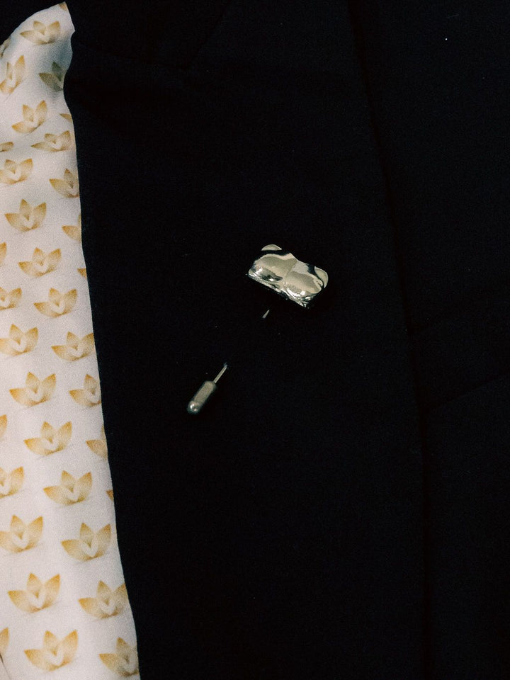 Silver Candace Bust / Breast / Bosom Stick Pin shown on a black jacket lapel