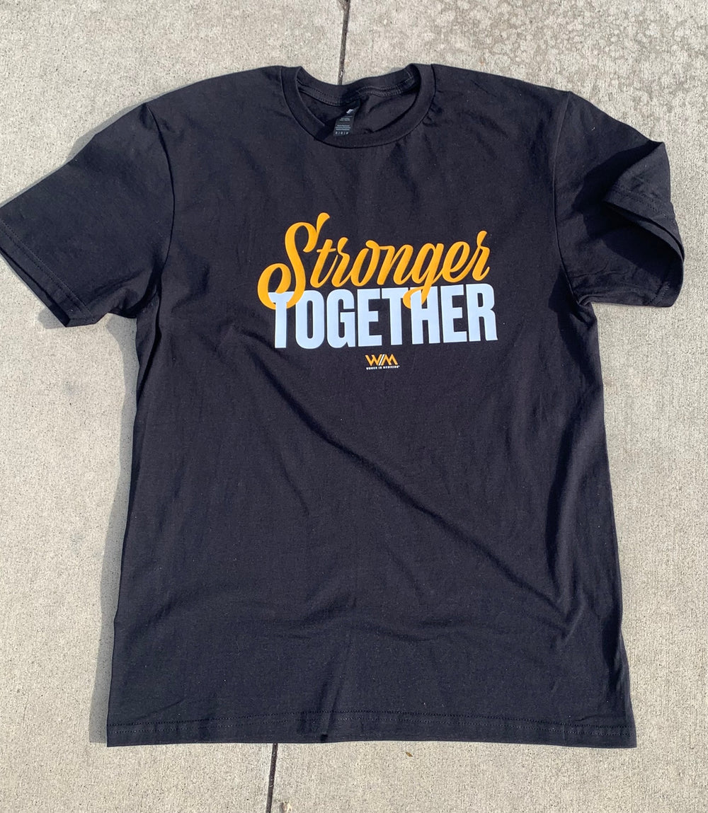 Black t-shirt with 'Stronger Together' text on a concrete surface