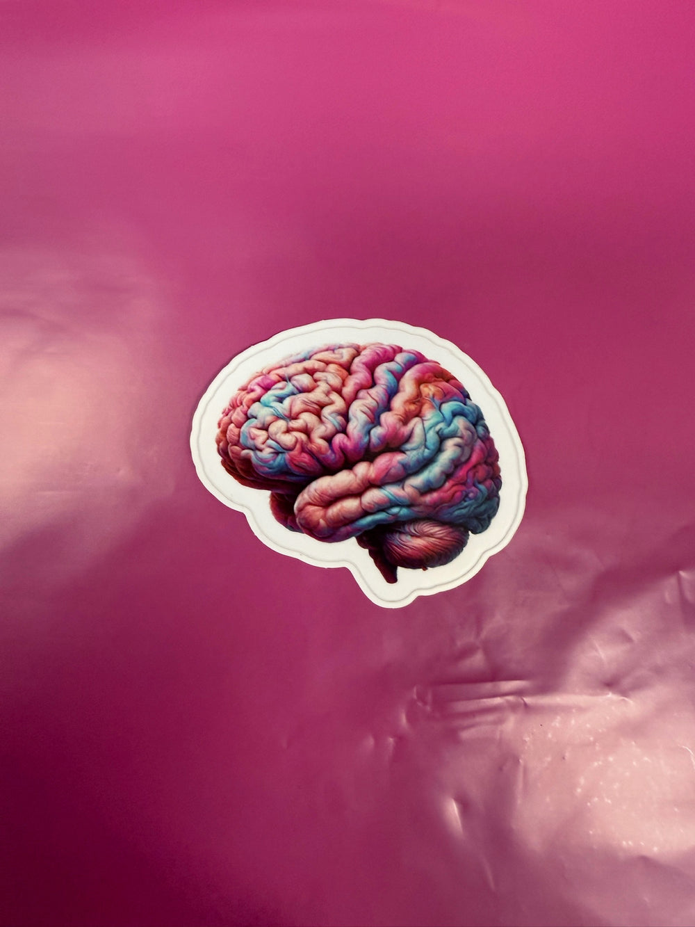 Colorful brain illustration on a pink background