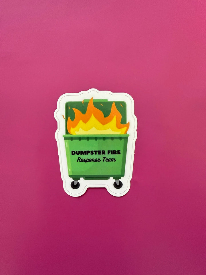 Sticker of a green dumpster with flames and 'Dumpster Fire Response Team' text on a pink background