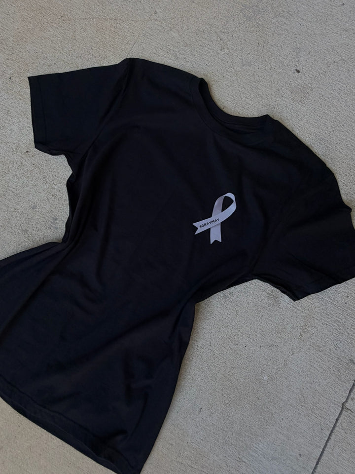 Black t-shirt with a gray #GRAYMAY ribbon symbol on a gray surface