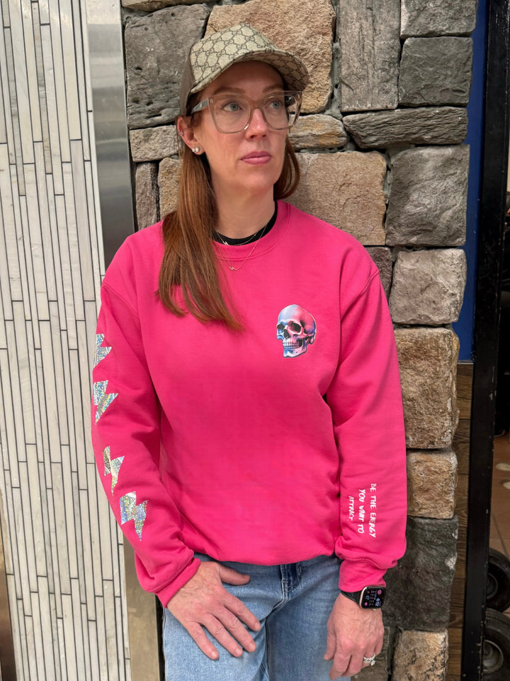 Ladyspinedoc wearing The Power Within Crewneck Sweatshirt - Pink Shirt with Lightning Bolts, Skull, and Motivational "BE THE ENERGY YOU WANT TO ATTRACT" Motto