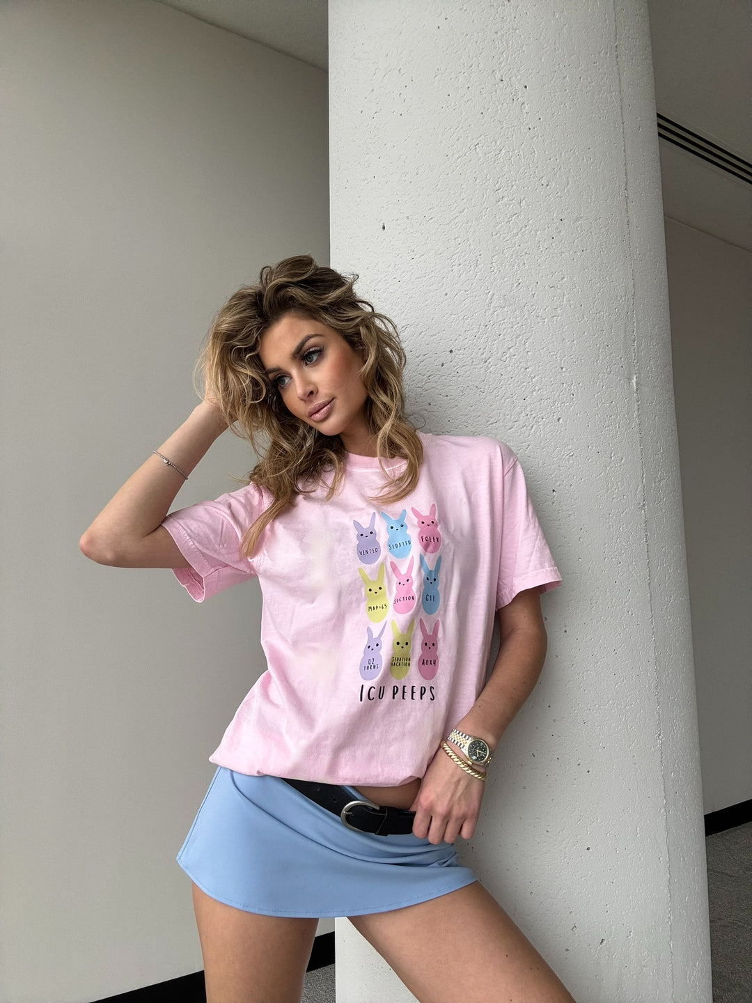 Model wearing the ICU Squad Tee – Pink Short Sleeve with Pastel Bunnies and ICU Lingo