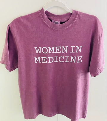 Burgundy t-shirt with 'WOMEN IN MEDICINE' text on a white background