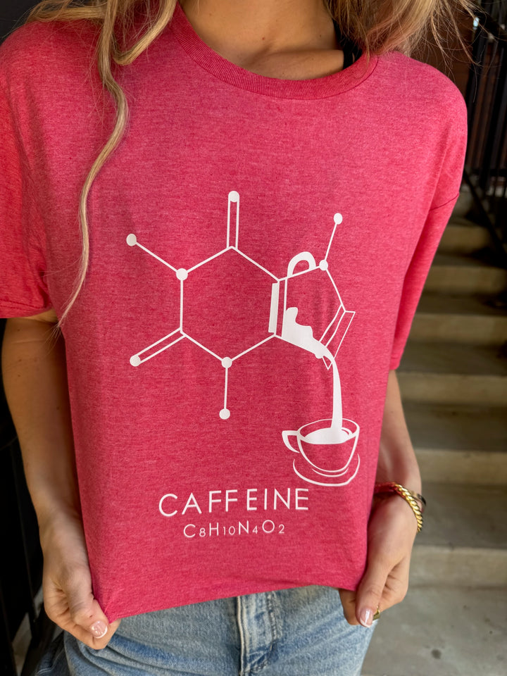 Red t-shirt with caffeine molecule design worn by a person