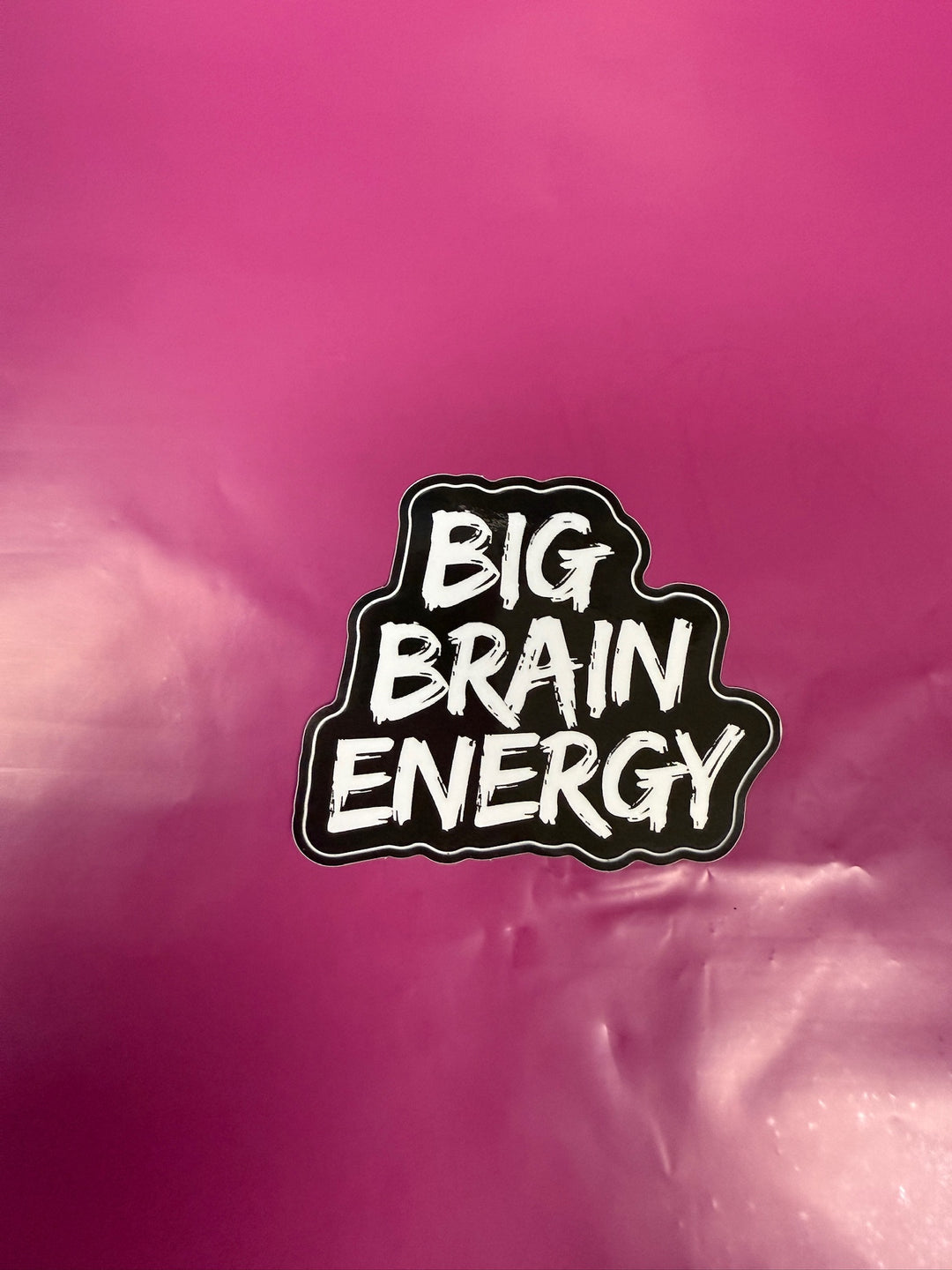 Sticker with 'BIG BRAIN ENERGY' text on a pink background