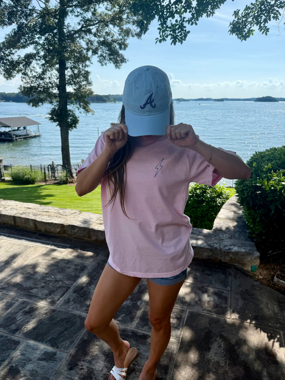 Model showing the front of the Bent, Not Broken Scoliosis Awareness Tee - Pink Cotton T-Shirt Short Sleeve with lightning bolt on upper left chest