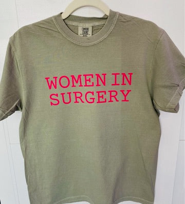 Green t-shirt with 'WOMEN IN SURGERY' in pink text on a white background