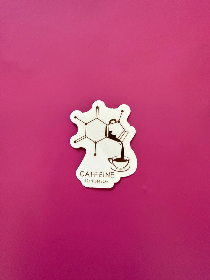 Caffeine molecule design (C₈H₁₀N₄O₂) shaped like a coffee carafe pouring into a cup sticker