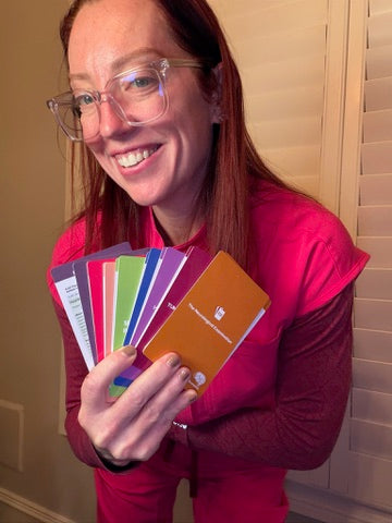 Ladyspinedoc holding a set of neurosurgery scrub cards
