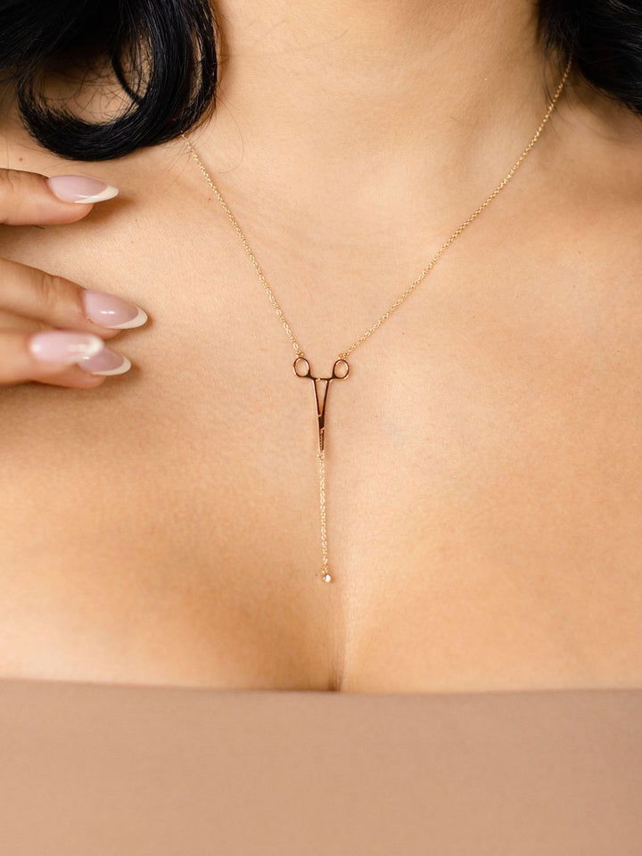 Gold Erin Necklace: Hemostat With Diamond Drop on model's neck