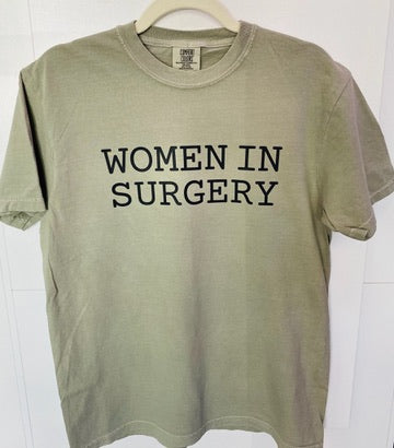 Green t-shirt with 'WOMEN IN SURGERY' text on a white background