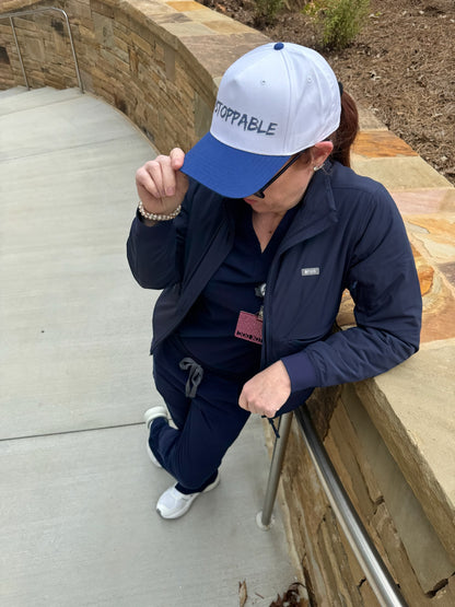 Stylish navy-and-white trucker hat ball cap with ‘UNSTOPPABLE’ logo
