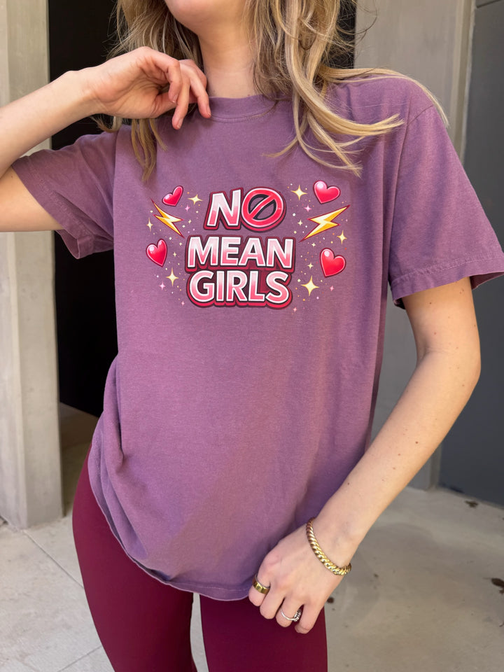 Person wearing a purple t-shirt with 'No Mean Girls' text and graphics.