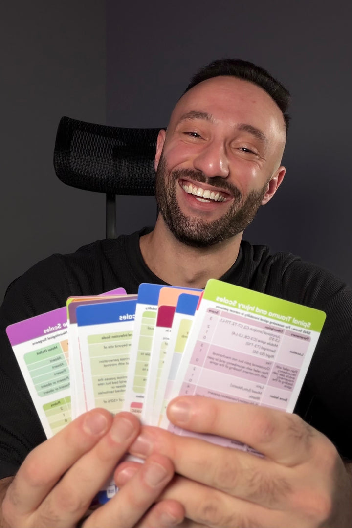 Dr. Z holding colorful scrub cards against a dark background