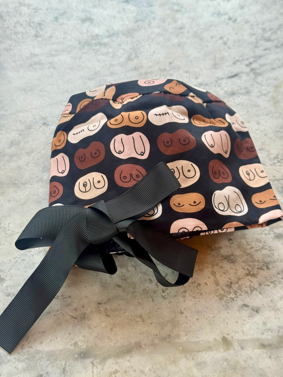Ponty tail version of the The Bosom Cap - Scrub Hat with Breast Design